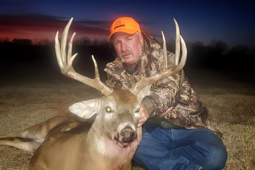 Outfitter, Greg Allen with a harvested mature Oklahoma whitetail.